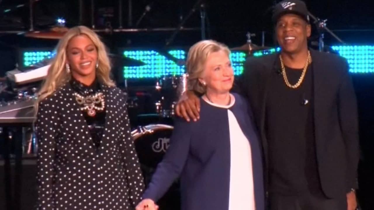 Beyoncé en Jay Z delen podium met Hillary Clinton