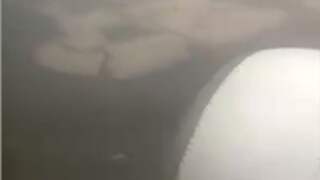 Passagier filmt 'gevaarlijke' smogdeken New Delhi vanuit vliegtuig