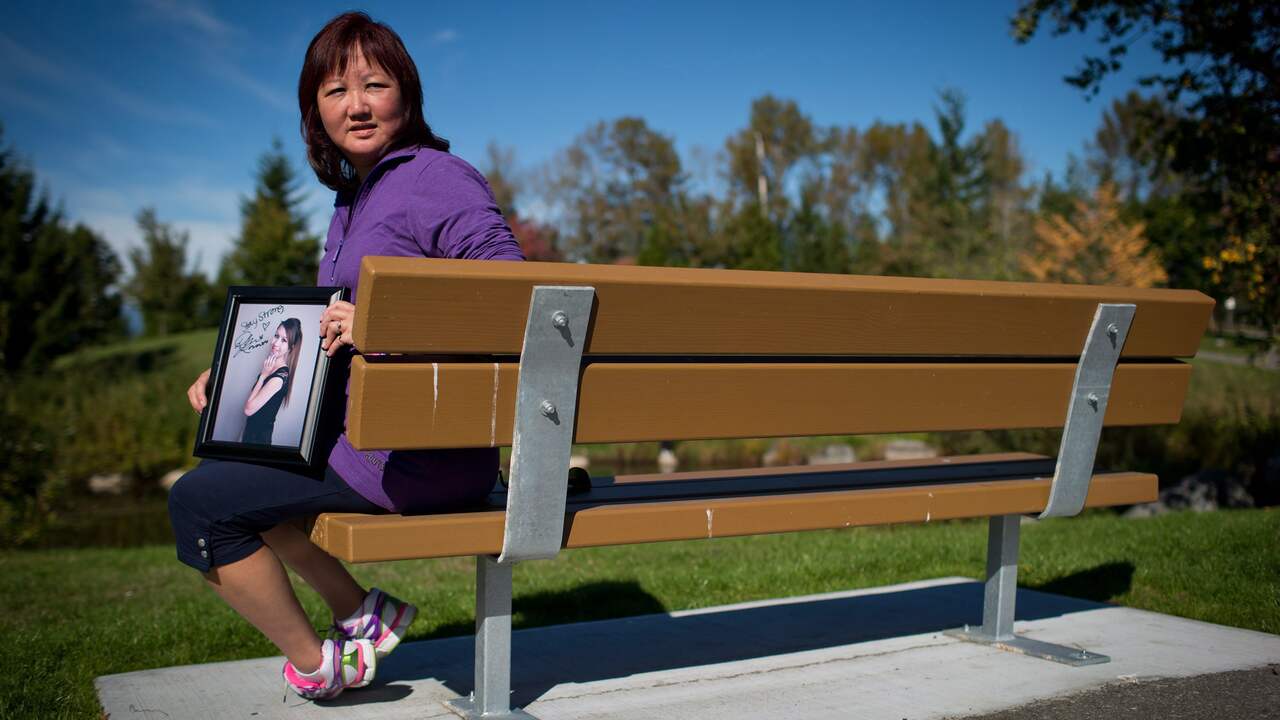 Carol Todd holds a photo of her daughter Amanda Todd.