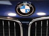 The logo of the German car maker BMW is seen at the front of a new car of German car maker BMW at the "BMW World" delivery center near the company's headquarters in Munich, southern Germany, on March 16, 2015. The company's annual press conference will take part in Munich on March 18, 2015.