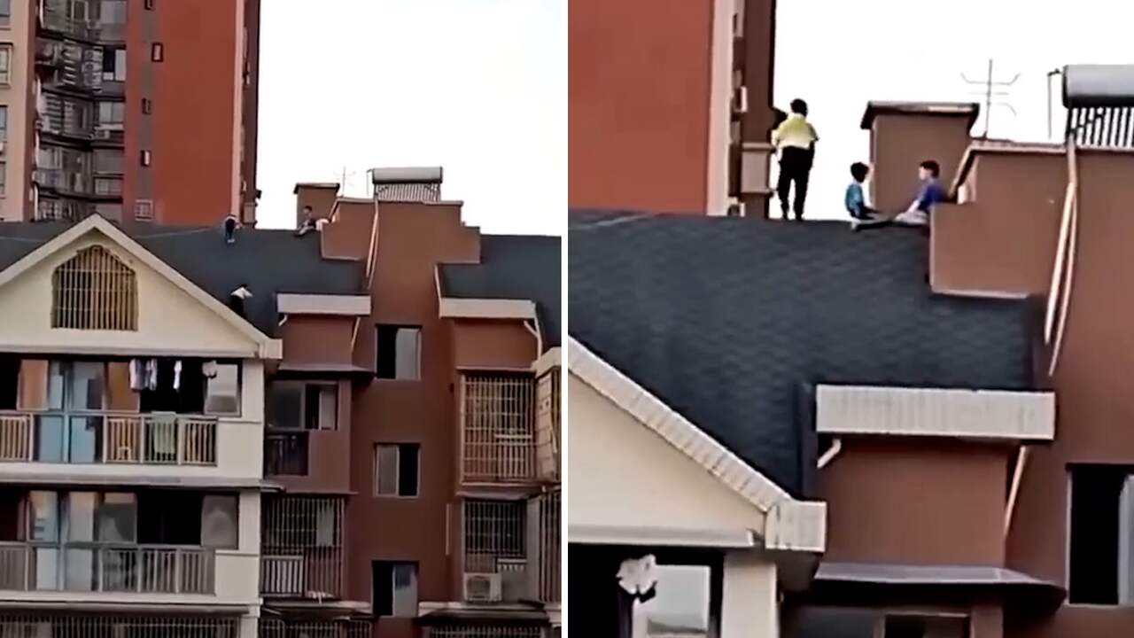 Beeld uit video: Kinderen klimmen op dak appartementencomplex in China