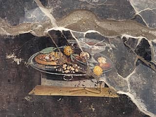 Muurschildering met mogelijke voorloper van pizza ontdekt in Pompeï