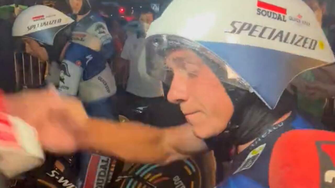 Image from video: Evenepoel knocks the microphone out of the hands of a reporter after a perilous team time trial