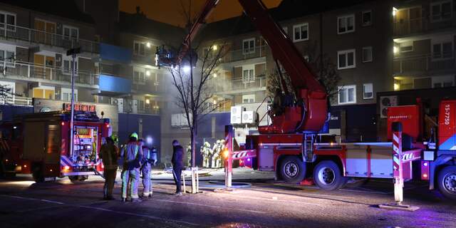 Woningen ontruimd bij brand in supermarkt in Houtwijk