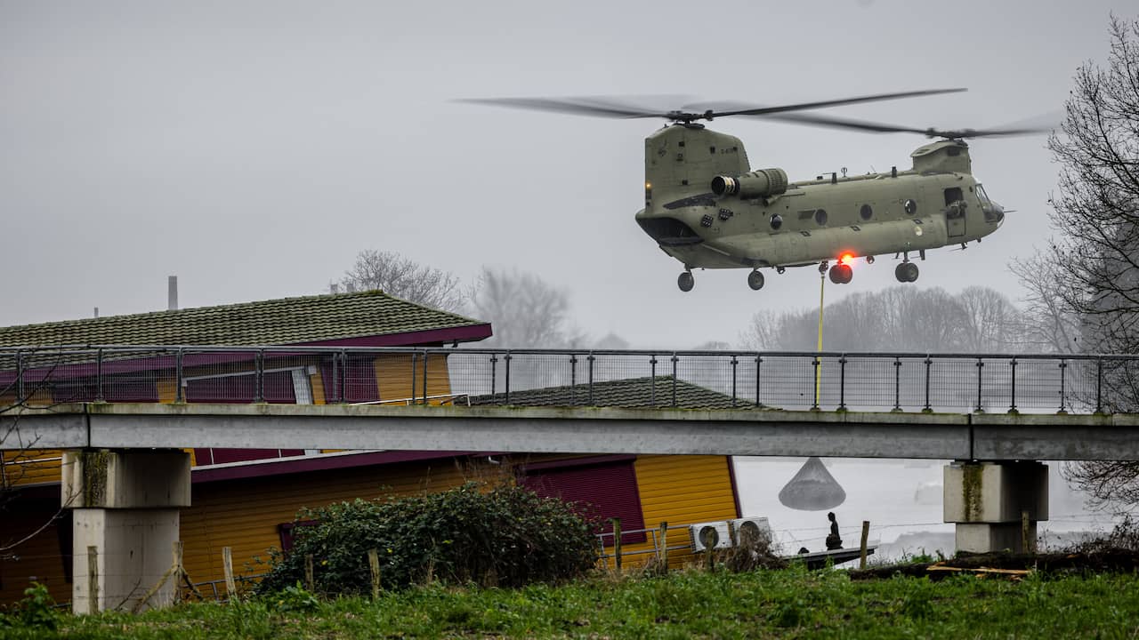 Emergency Dam Construction in Maastricht: Defense Chinook Helicopters Lower Nets of Stones onto Broken Dam