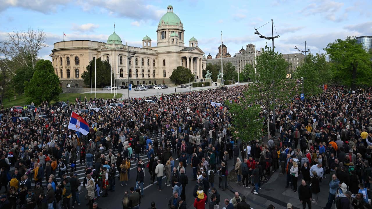 Tens of thousands of Serbs take to the streets to protest the recent shootings |  outside