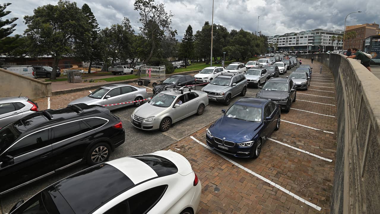 Australians who wait hours on test street fined for phone use |  NOW