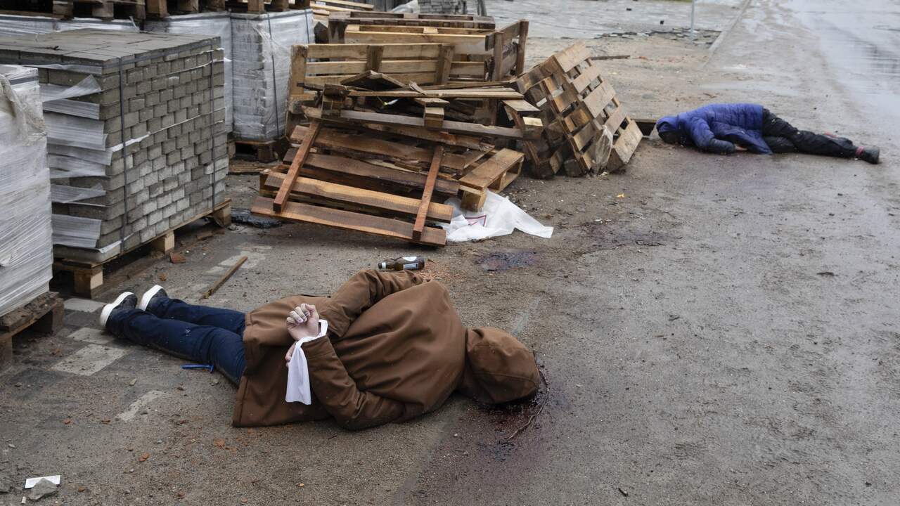 Dozens of dead were found with their hands tied behind their backs.