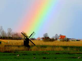 Regenboog bij Zaanse Schans