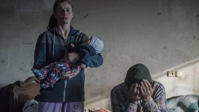 A couple about to leave their home in Lachin, Armenia.  Many Armenians left places in the disputed Nagorno-Karrabach enclave, which was captured by Armenian forces in 1994 and returned to Azerbaijani hands under the terms of a recent ceasefire.