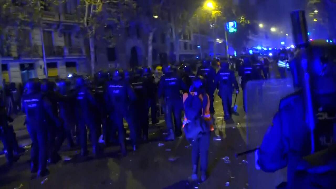 Image from video: Spanish police clear demonstrators during riots in Madrid