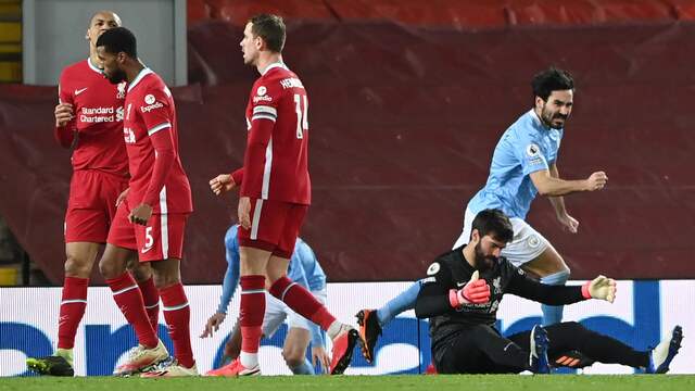 Vreugde bij Ilkay Gündogan en teleurstelling bij Alisson na de 1-2.