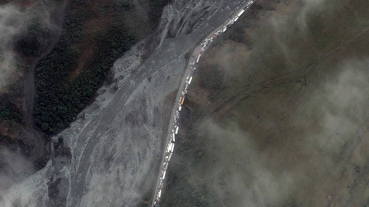 A satellite image shows long lines of cars and trucks on their way to the Georgian-Russian border.