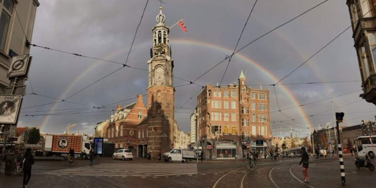 Amsterdam ontwaakt met dubbele regenboog boven de stad