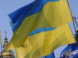 Vrijdag 26 oktober: Supporters van de regeringsgezinde Partij van de Regio's zwaaien met vlaggen in de Oekraïense hoofdstad Kiev.