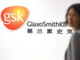 CHINA, Shanghai : An employee of British drug firm GlaxoSmithKline (GSK) enters their office headquarters in Shanghai on July 1, 2013. Chinese police are investigating senior management staff GlaxoSmithKline in China for suspected "economic crimes", according to a statement which was reported by state media. AFP PHOTO / Peter PARKS
