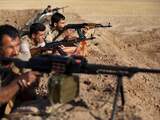 Maandag 15 september: Koerdische Peshmerga-strijders richten hun wapens op doelen van de Islamitische Staat (IS), veertig kilometer ten zuiden van Erbil. 