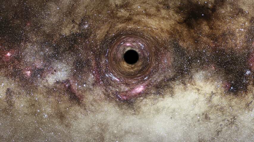 Astronomen vinden dankzij zwaartekrachtlens een van grootste zwarte gaten ooit