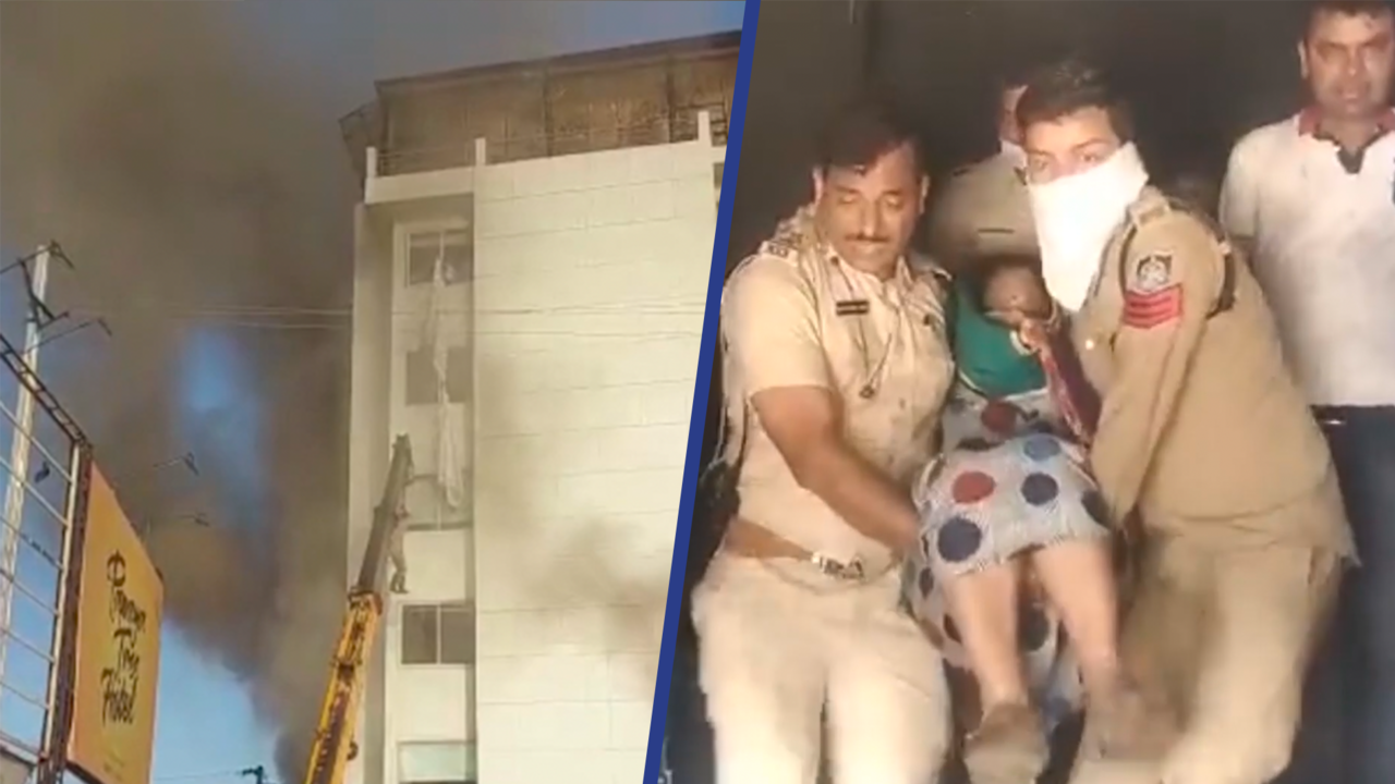 Beeld uit video: Hulpdiensten dragen vrouw uit brandend hotel in India