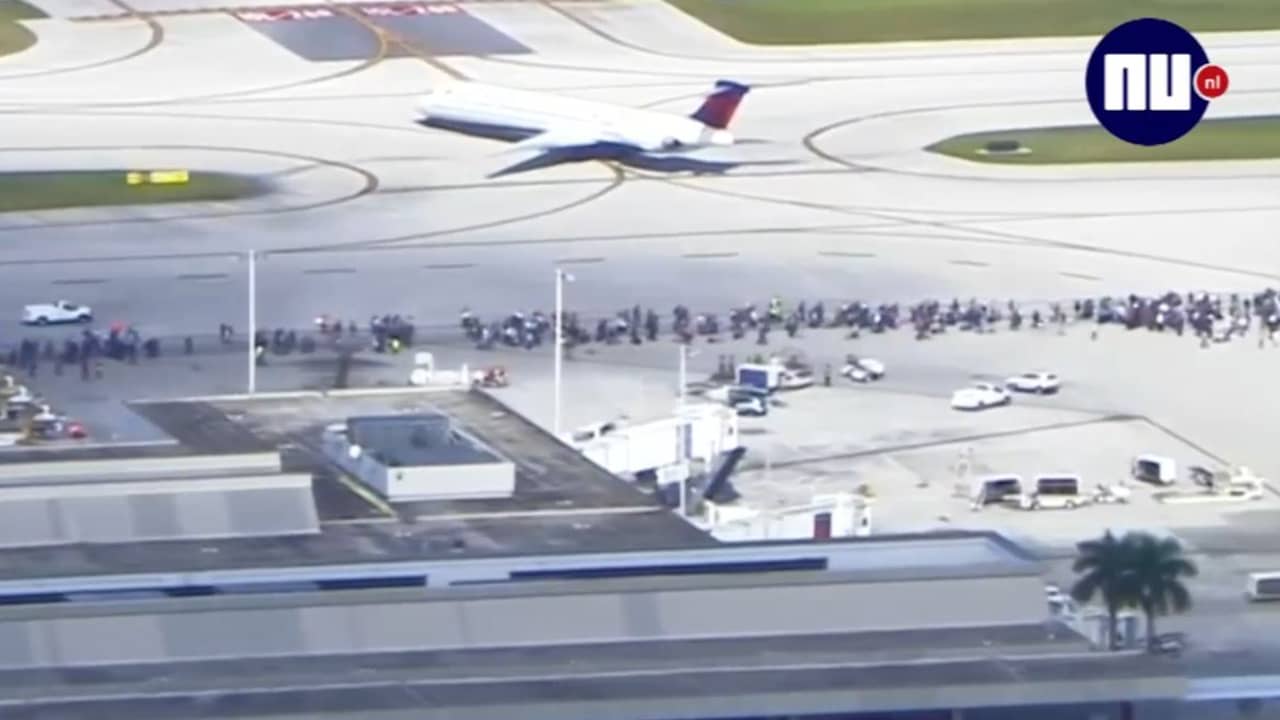 Beeld uit video: Passagiers rennen tussen vliegtuigen na schietpartij Fort Lauderdale
