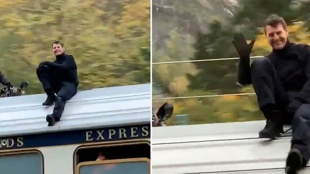 Beeld uit video: Tom Cruise zwaait naar fans tijdens stunt op dak van trein