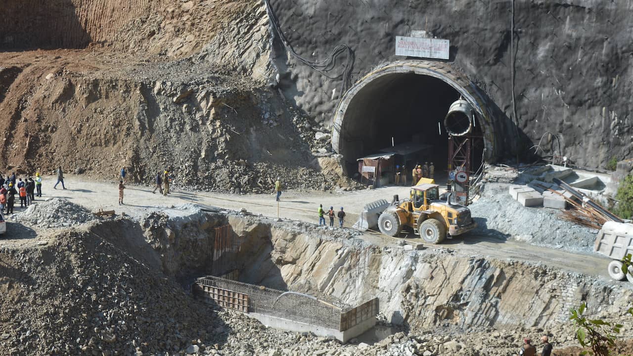 Rescue workers dig tunnels for construction workers in India who have been stranded for a week  outside