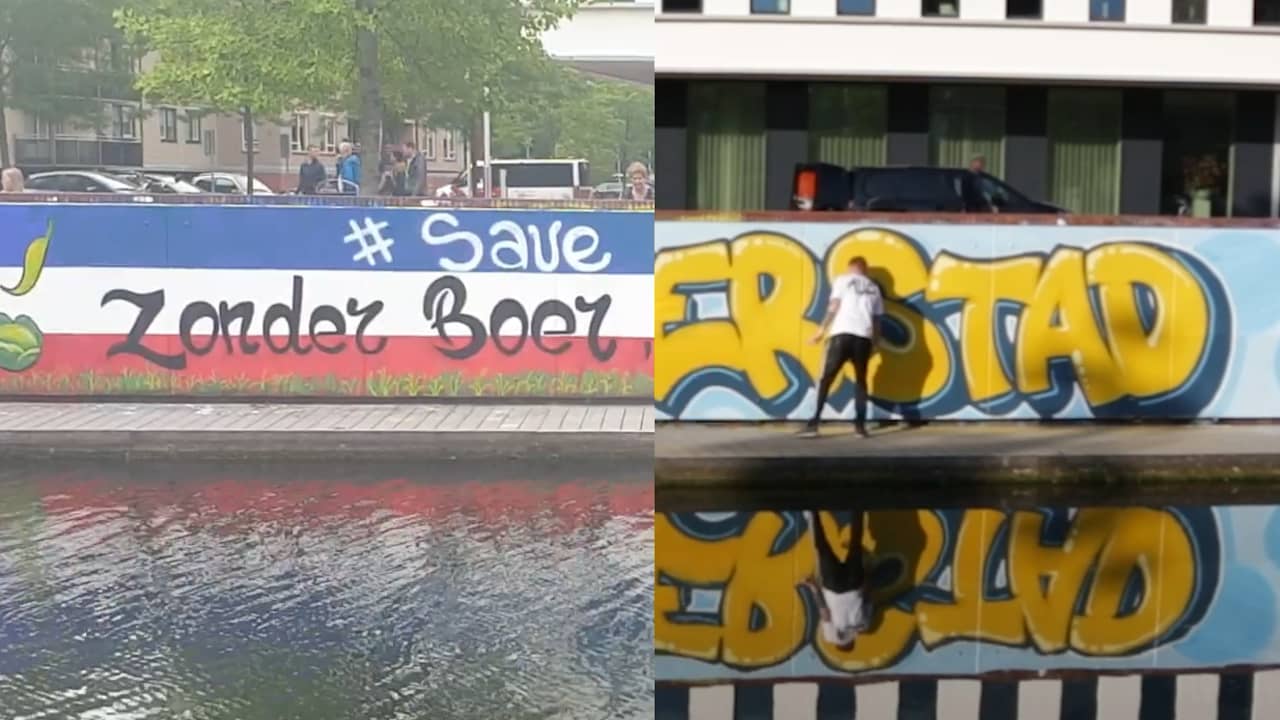 Beeld uit video: Artiesten spuiten omgekeerde vlag over in Almelo
