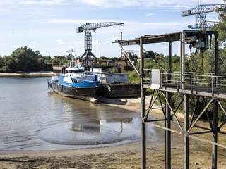 Rijn bereikt laagste waterstand ooit op plek waar rivier Nederland binnenkomt