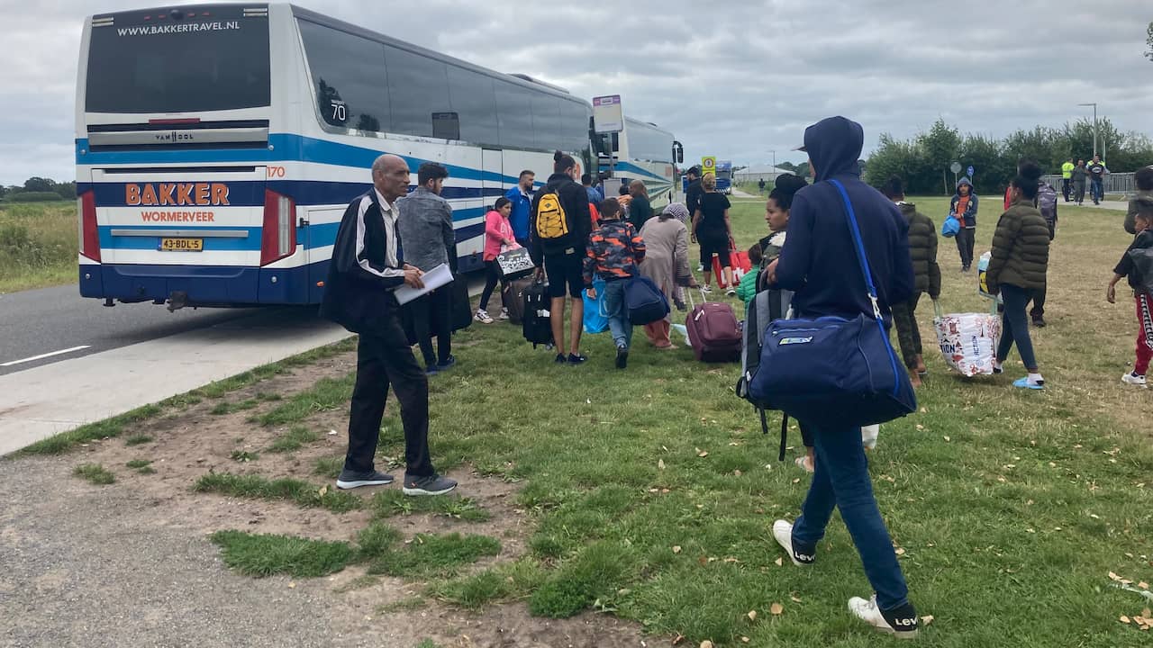 Asylum seekers depart by bus from Ter Apel to an emergency reception location in the country.