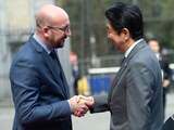 Belgian Prime Minister Charles Michel (L) shakes hands with Japanese Prime Minister Shinzo Abe prior to a meeting, on May 3, 2016, in Brussels. 